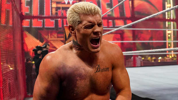 A bruised Cody Rhodes winces during his match vs. Seth Rollins